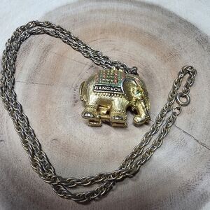gold-toned elephant locket necklace